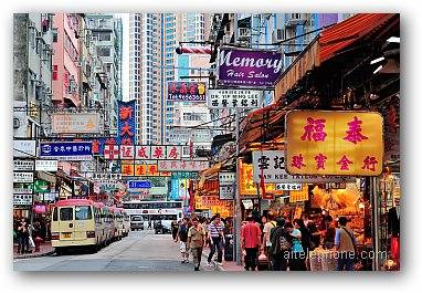 HONG KONG, CHINA - Street view with traffic and shops on April 23, 2012 in Hong Kong, China.