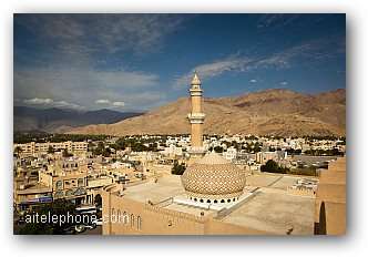 Stunning view of the Nizwa fort surrounded by mountains - Oman Toll Free Conference Call